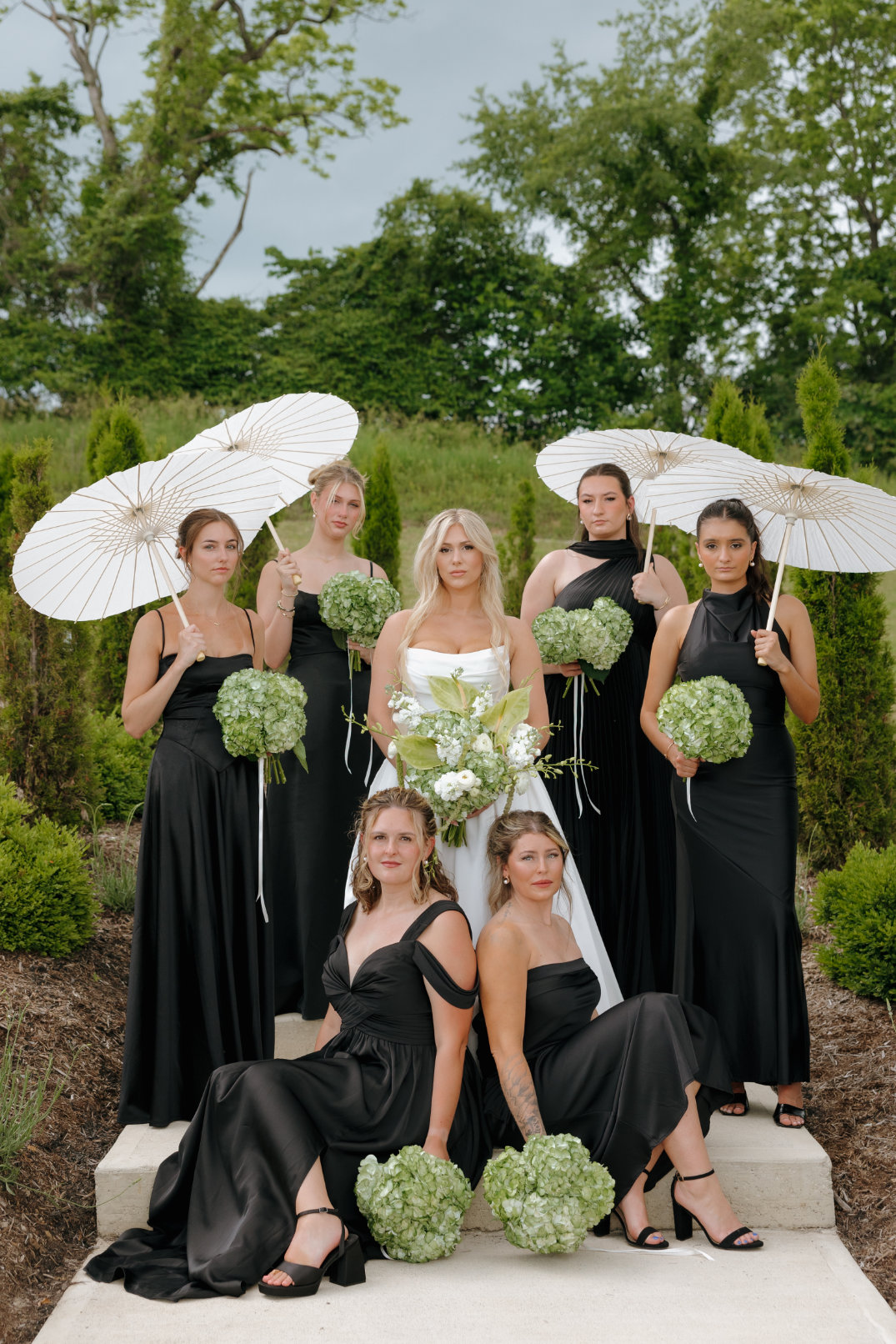 Black bridesmaids posing around an Ohio bride.