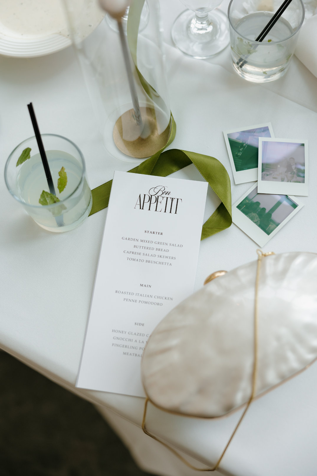 Flat lay of wedding stationery and cocktails styled for the reception at The Seventy Five Venue in Hocking Hills, Ohio, photographed by Chloe Elizabeth Photography.